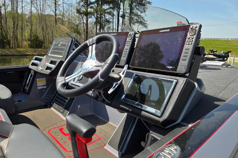 Slide: The Image of 2023 Ranger Z520R 55th Anniversary boat dashboard with advanced navigation displays. - 13