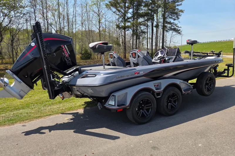 Slide: The Image of 2023 Ranger Z520R 55th Anniversary Limited Edition boat on trailer, parked outdoors. - 2