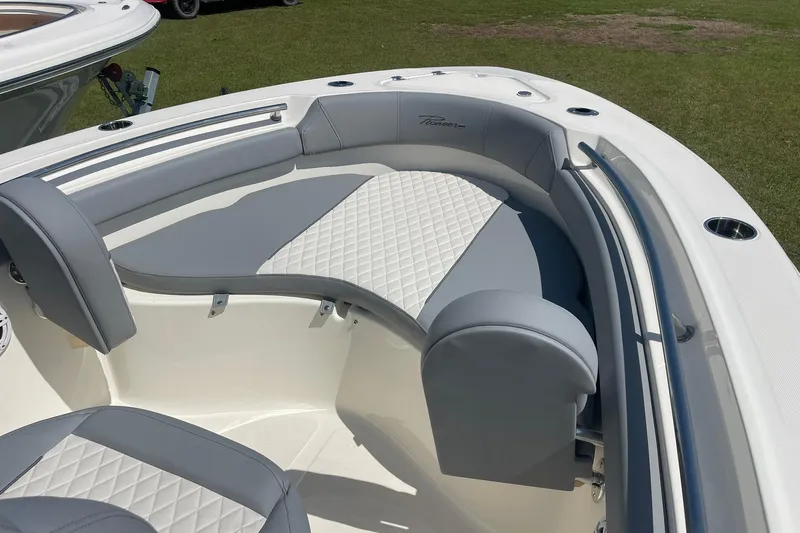 Slide: The Image of 2026 Pioneer 202 Islander boat with stylish gray and white seating on grassy background. - 12