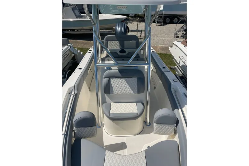 Slide: The Image of 2026 Pioneer 202 Islander boat interior with cushioned seating and sleek design. - 13