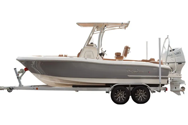 Slide: The Image of Manufacturer Provided Image: 2025 Pioneer 202 Islander boat on trailer, featuring sleek design and Suzuki outboard motor. - 2