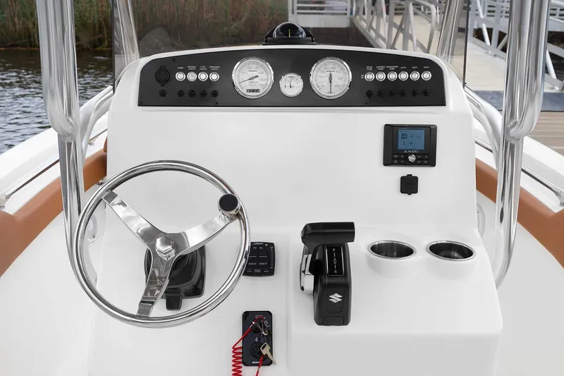 Slide: The Image of Manufacturer Provided Image: 2025 Pioneer 202 Islander boat dashboard with steering wheel, gauges, and controls. - 5
