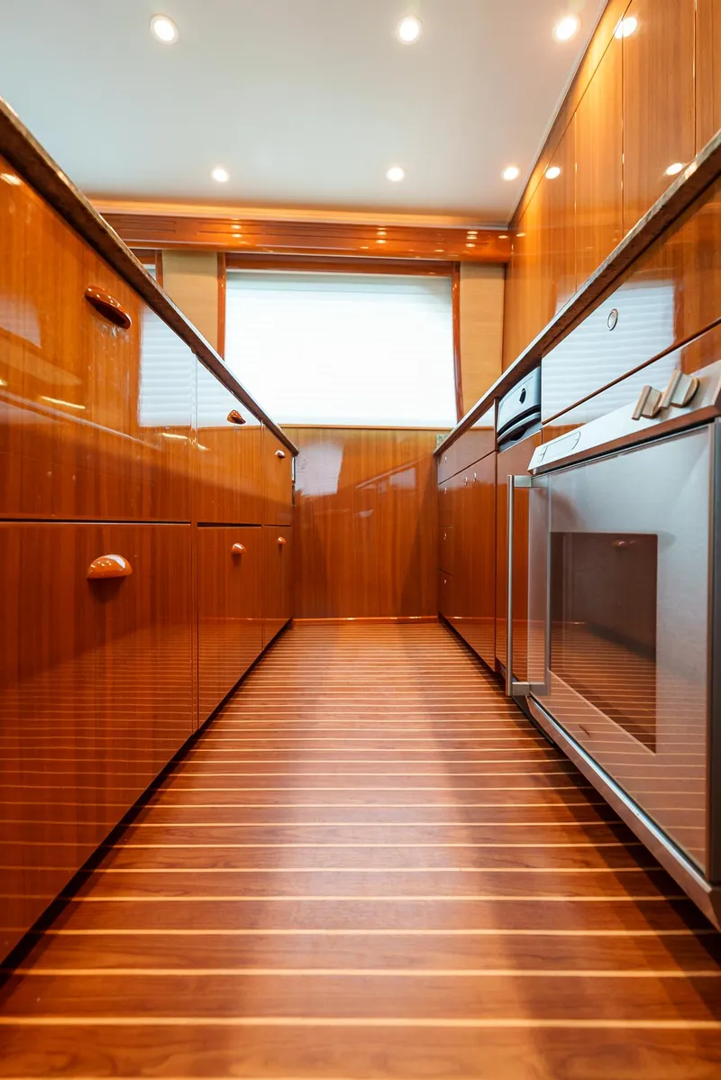 Slide: The Image of Luxurious kitchen interior of 2008 Viking 68 Skybridge yacht with wooden cabinetry. - 13