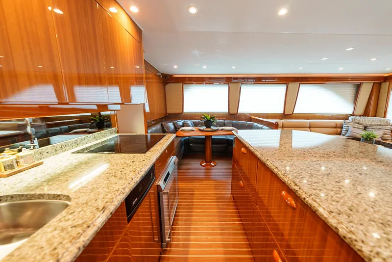 Slide: The Image of Luxurious interior of 2008 Viking 68 Skybridge yacht with granite countertops and wooden cabinetry. - 15