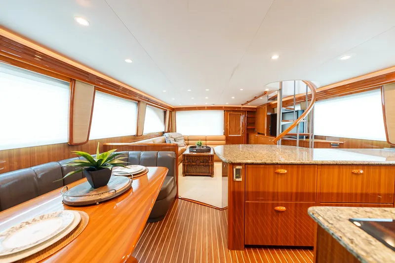 Slide: The Image of Luxurious interior of 2008 Viking 68 Skybridge yacht with modern kitchen and dining area. - 18