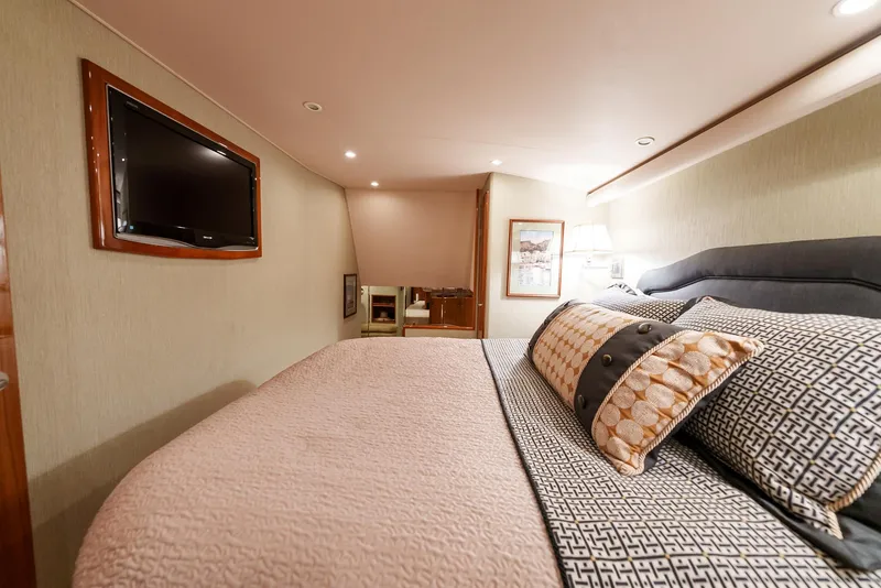 Slide: The Image of Luxurious bedroom interior of 2008 Viking 68 Skybridge yacht with TV and elegant bedding. - 19