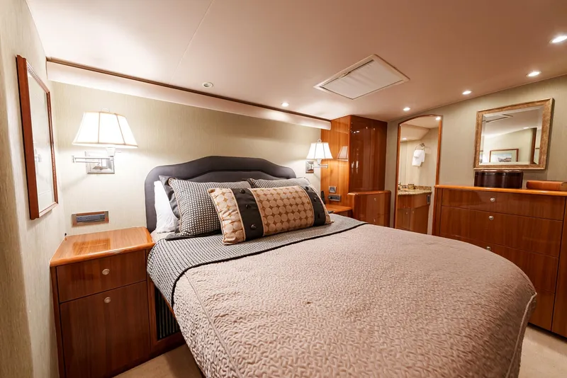 Slide: The Image of Luxurious bedroom interior of 2008 Viking 68 Skybridge yacht with elegant wood finishes. - 22