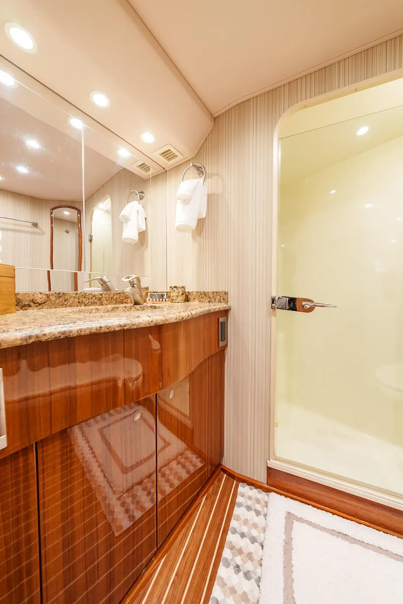 Slide: The Image of Luxurious bathroom in a 2008 Viking 68 Skybridge yacht with modern fixtures. - 24