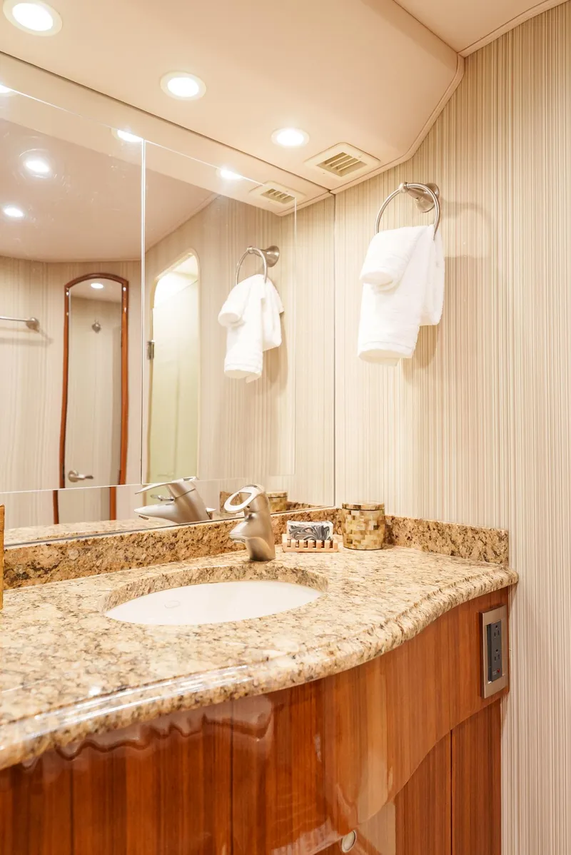 Slide: The Image of Luxurious bathroom in 2008 Viking 68 Skybridge yacht with granite countertop. - 25