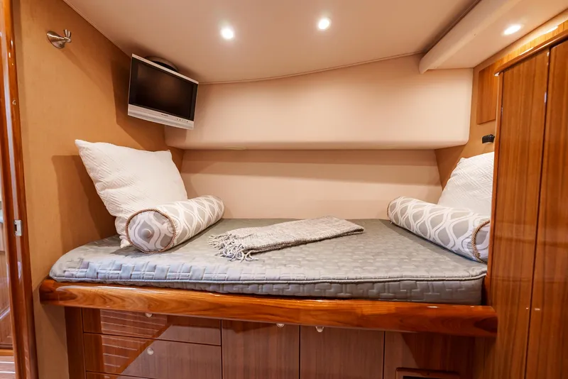 Slide: The Image of Cozy cabin interior of 2008 Viking 68 Skybridge yacht with bed and TV. - 35