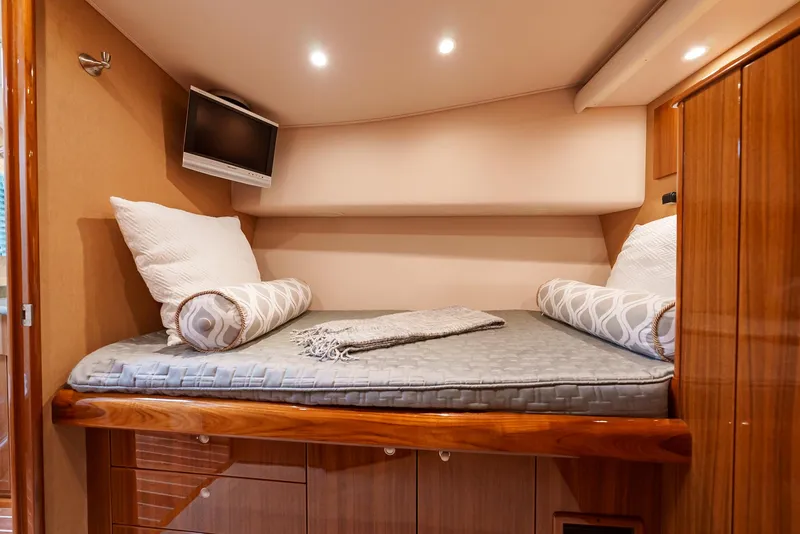 Slide: The Image of Cozy cabin bed in 2008 Viking 68 Skybridge yacht with TV and pillows. - 36