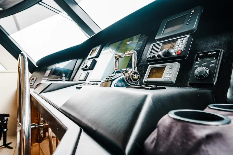Slide: The Image of Control panel of a 2008 Viking 68 Skybridge yacht with navigation instruments. - 4