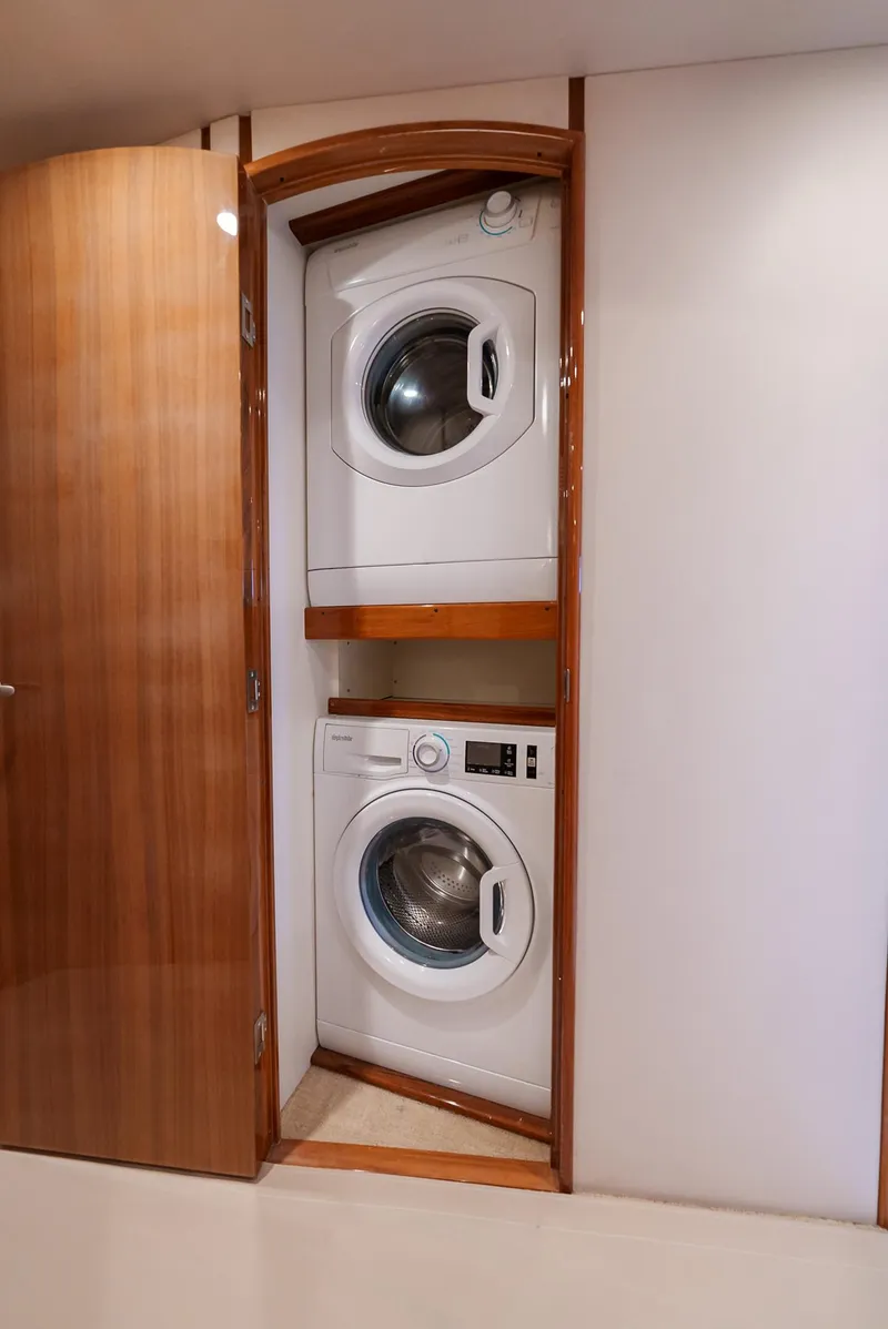 Slide: The Image of Stacked washer and dryer in 2008 Viking 68 Skybridge yacht. - 42
