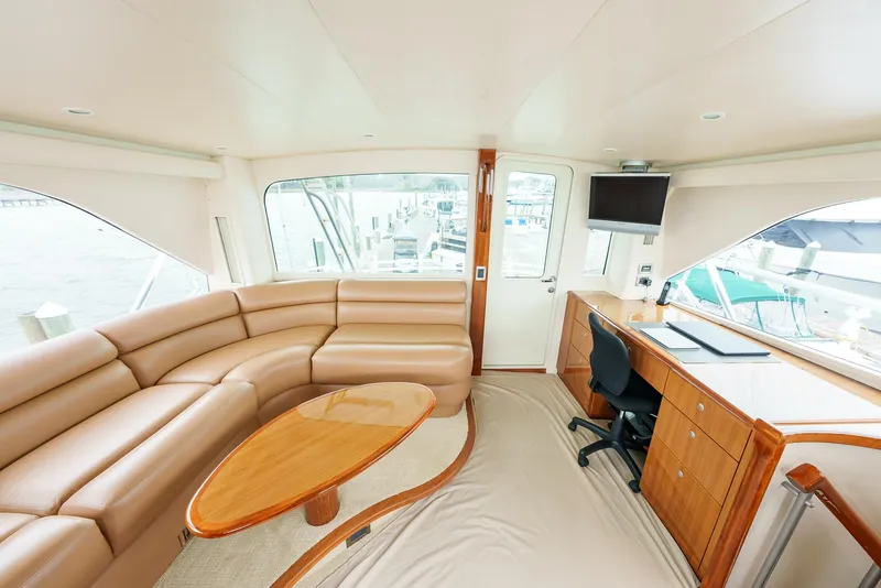 Slide: The Image of Luxurious interior of 2008 Viking 68 Skybridge yacht with leather seating and office desk. - 47