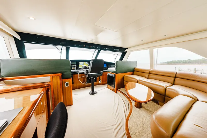 Slide: The Image of Luxurious interior of 2008 Viking 68 Skybridge yacht with leather seating and modern helm. - 48