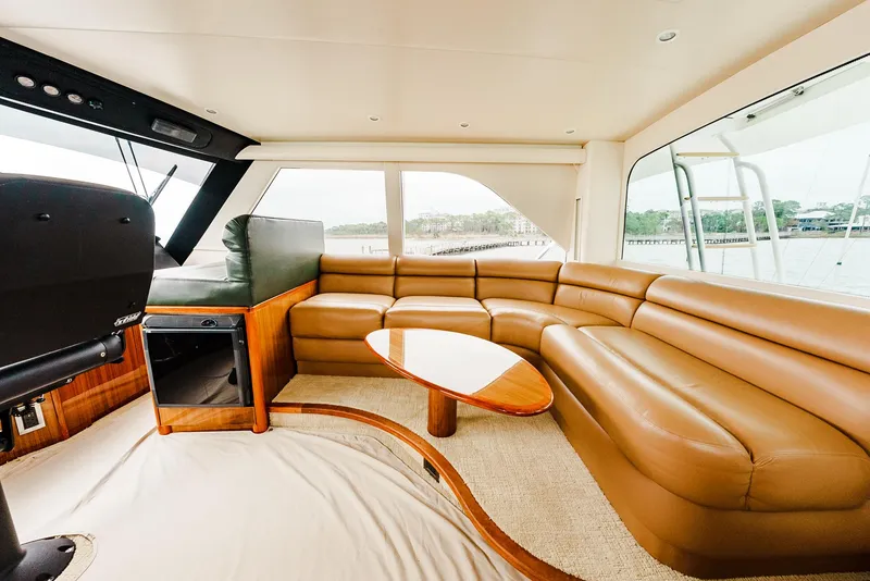 Slide: The Image of Luxurious interior of 2008 Viking 68 Skybridge yacht with leather seating and panoramic windows. - 49