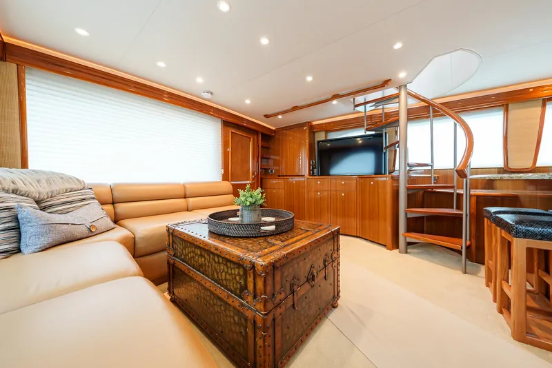 Slide: The Image of Luxurious interior of 2008 Viking 68 Skybridge yacht with leather seating and wooden accents. - 6