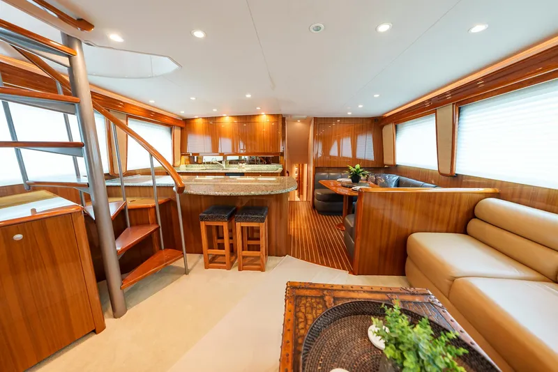 Slide: The Image of Luxurious interior of 2008 Viking 68 Skybridge yacht with modern kitchen and seating area. - 8