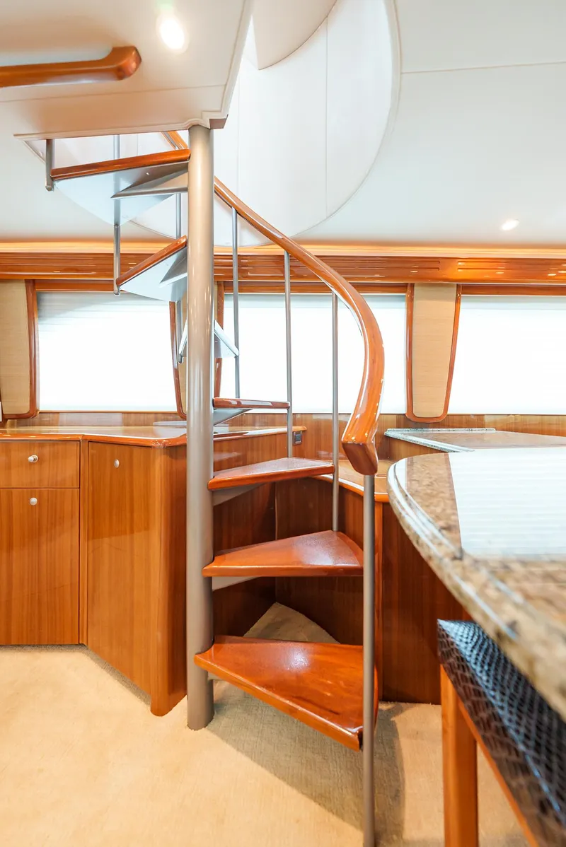 Slide: The Image of Spiral staircase in 2008 Viking 68 Skybridge yacht interior. - 9