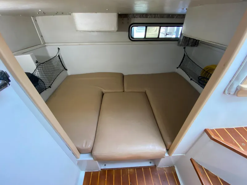 Slide: The Image of 1997 Stamas 310 Express cabin interior with beige cushions and wooden steps. - 19