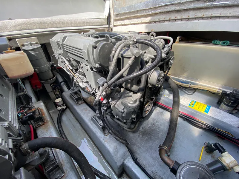 Slide: The Image of 1997 Stamas 310 Express engine compartment with visible wiring and components. - 27