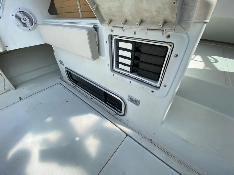 Slide: The Image of 1997 Stamas 310 Express boat interior showing ventilation and seating area. - 36