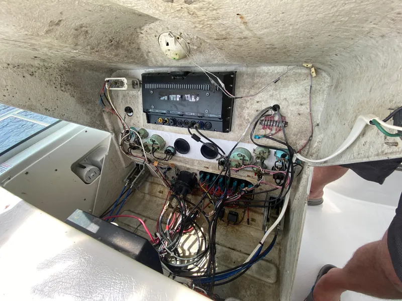 Slide: The Image of 1997 Stamas 310 Express boat electrical panel with exposed wiring. - 38