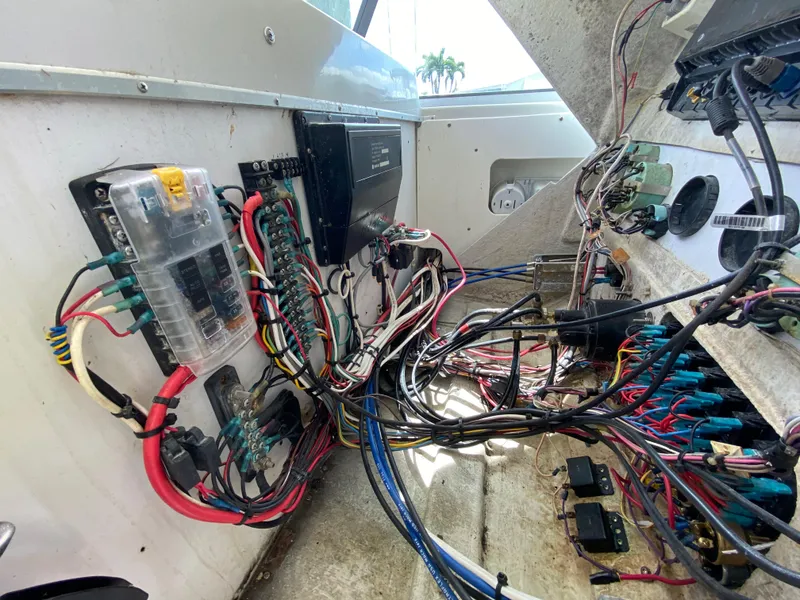 Slide: The Image of Electrical wiring and components inside a 1997 Stamas 310 Express boat. - 39