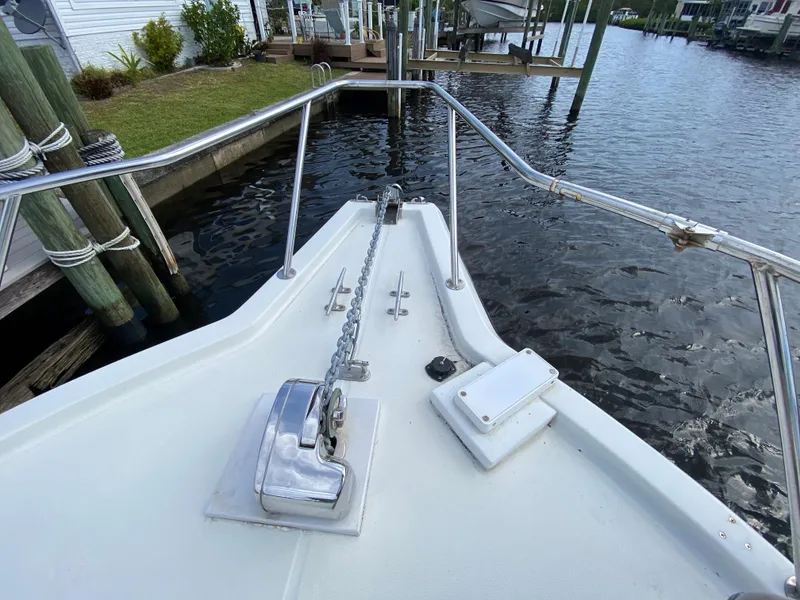 Slide: The Image of 1997 Stamas 310 Express boat bow with anchor chain and windlass. - 4