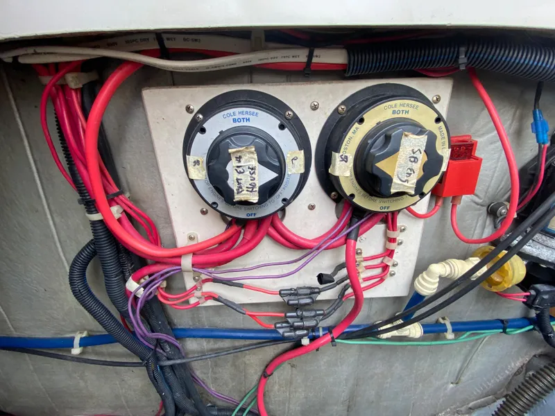 Slide: The Image of Electrical wiring and switches on a 1997 Stamas 310 Express boat. - 42