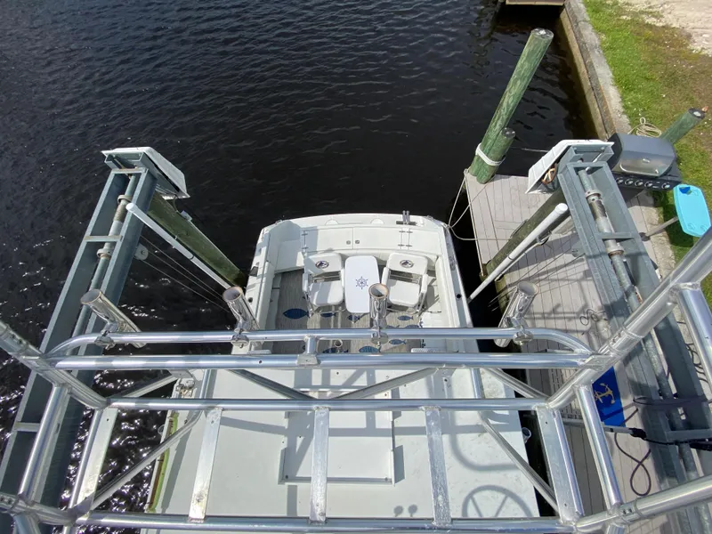 Slide: The Image of 1997 Stamas 310 Express boat docked at marina, aerial view. - 8