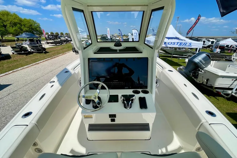 Slide: The Image of 2026 Pioneer 250 Pelagic boat interior with steering wheel and control panel. - 5