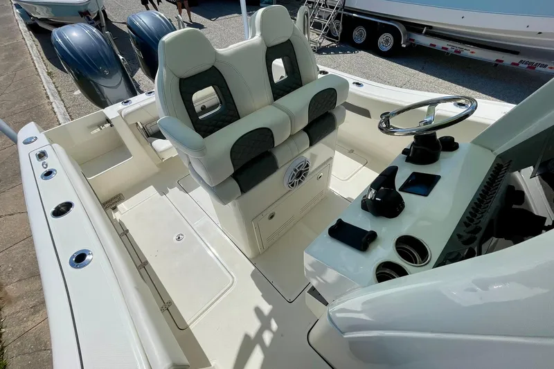 Slide: The Image of 2026 Pioneer 250 Pelagic boat interior with dual seats and modern helm controls. - 7