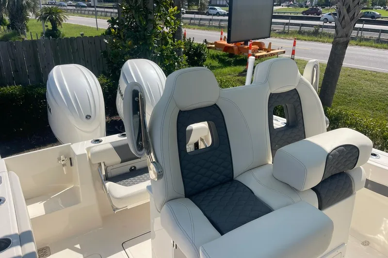 Slide: The Image of 2026 Pioneer 250 Pelagic boat with dual Yamaha engines and luxurious seating. - 4