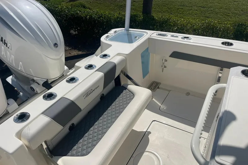 Slide: The Image of 2026 Pioneer 250 Pelagic boat interior with Yamaha engine, featuring seating and fishing rod holders. - 6