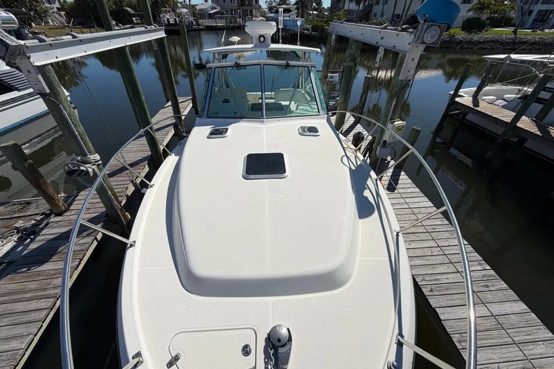 Slide: The Image of 2001 Pursuit 3000 Express boat docked at marina, top view. - 11