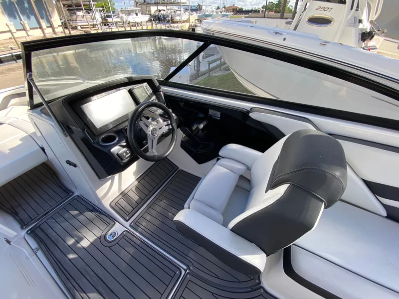 Slide: The Image of 2018 Yamaha Boats 242 Limited S interior with sleek dashboard and comfortable seating. - 5