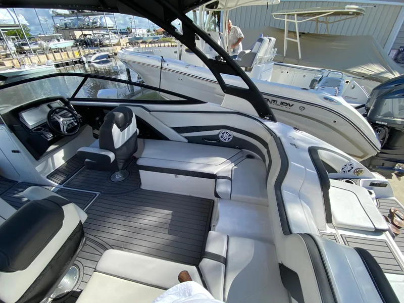 Slide: The Image of 2018 Yamaha Boats 242 Limited S interior with sleek seating and modern dashboard. - 9