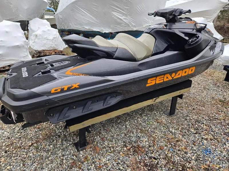 Slide: The Image of 2022 Sea-Doo BRP GTX 300 jet ski on gravel surface. - 5