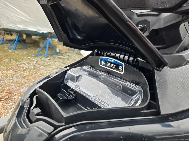 Slide: The Image of 2022 Sea-Doo BRP GTX 300 storage compartment with open lid. - 6