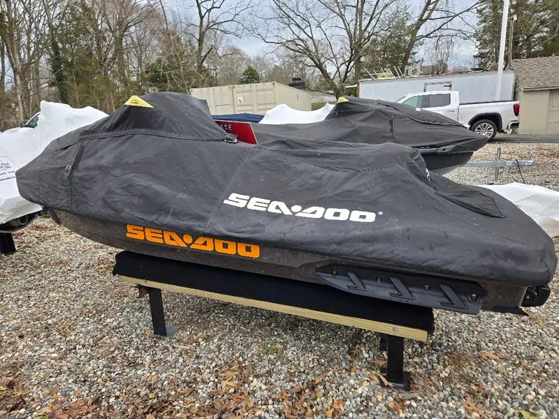 Slide: The Image of 2022 Sea-Doo BRP GTX 300 with cover on gravel lot. - 8