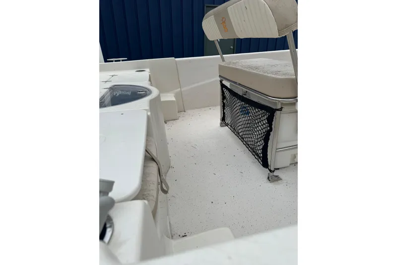 Slide: The Image of 2016 Carolina Skiff 218 DLV boat interior with seating and storage net. - 4