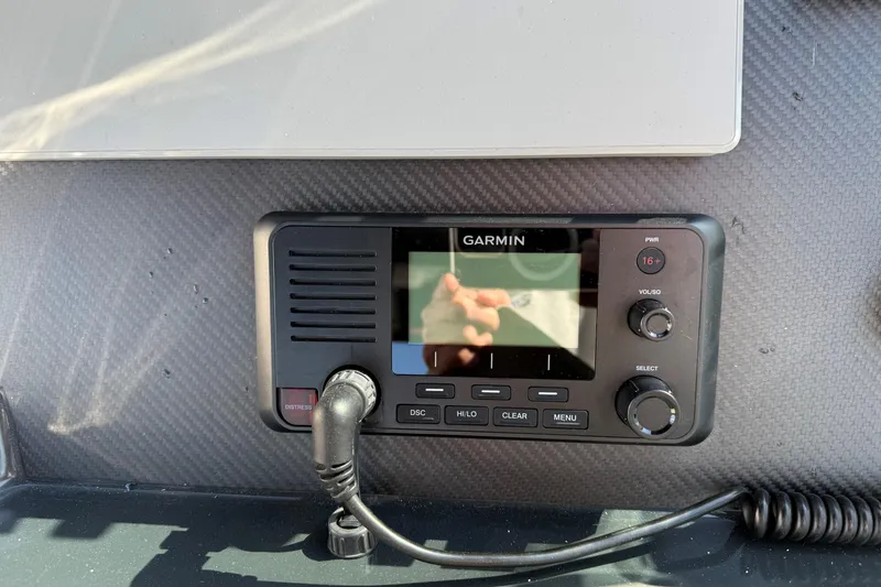 Slide: The Image of Garmin marine radio on Skipper-BSK 38NC, 2024 model, with carbon fiber dashboard. - 13