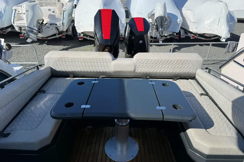 Slide: The Image of 2024 Skipper-BSK 38NC boat interior with seating and table, featuring dual engines. - 16