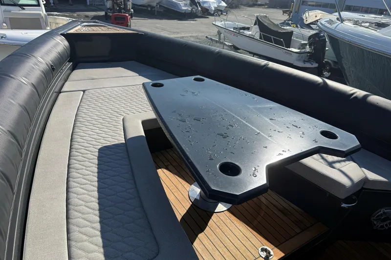Slide: The Image of Luxurious seating area on 2024 Skipper-BSK 38NC boat with sleek table design. - 5