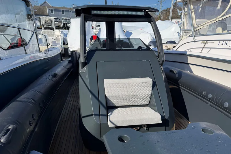 Slide: The Image of 2024 Skipper-BSK 38NC boat with modern design and cushioned seating. - 7