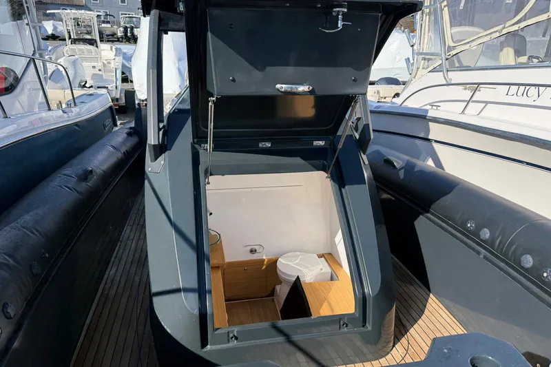 Slide: The Image of 2024 Skipper-BSK 38NC boat interior with open hatch, showcasing compact cabin space. - 8