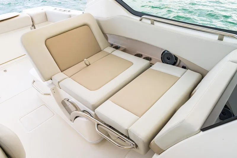 Slide: The Image of Luxurious seating on 2026 Boston Whaler 240 Vantage boat, featuring beige and white upholstery. - 10