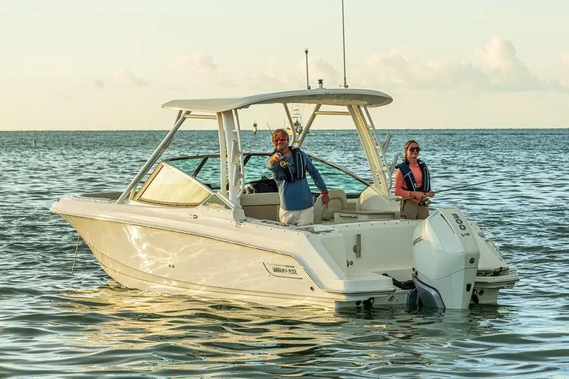 Slide: The Image of Manufacturer Provided Image: 2026 Boston Whaler 240 Vantage boat on water with two people fishing. - 2