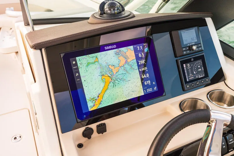 Slide: The Image of Dashboard of 2026 Boston Whaler 240 Vantage with navigation system and controls. - 9